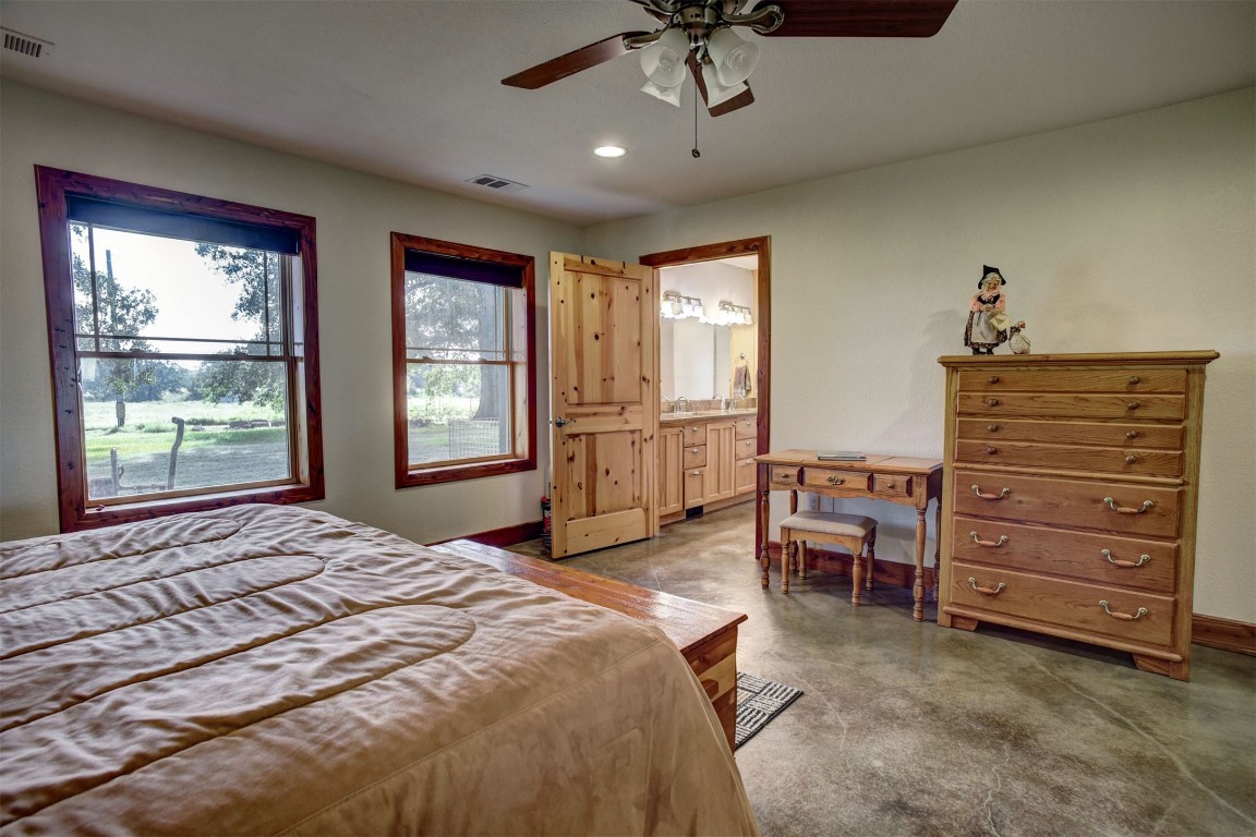 945 Justice Road West Point, TX 78963 - Photo 12 of 21 a bedroom with a bed and furniture with windows
