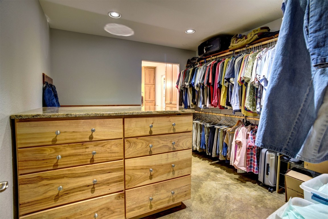 945 Justice Road West Point, TX 78963 - Photo 13 of 21 a view of walk in closet with clothes and shoes