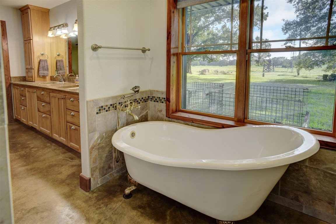 945 Justice Road West Point, TX 78963 - Photo 15 of 21 a white bath tub sitting next to a bathroom sink