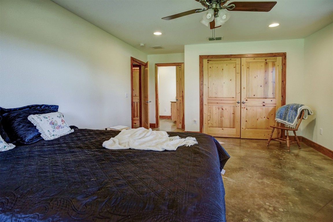 945 Justice Road West Point, TX 78963 - Photo 16 of 21 a bed sitting in a spacious bedroom next to a window