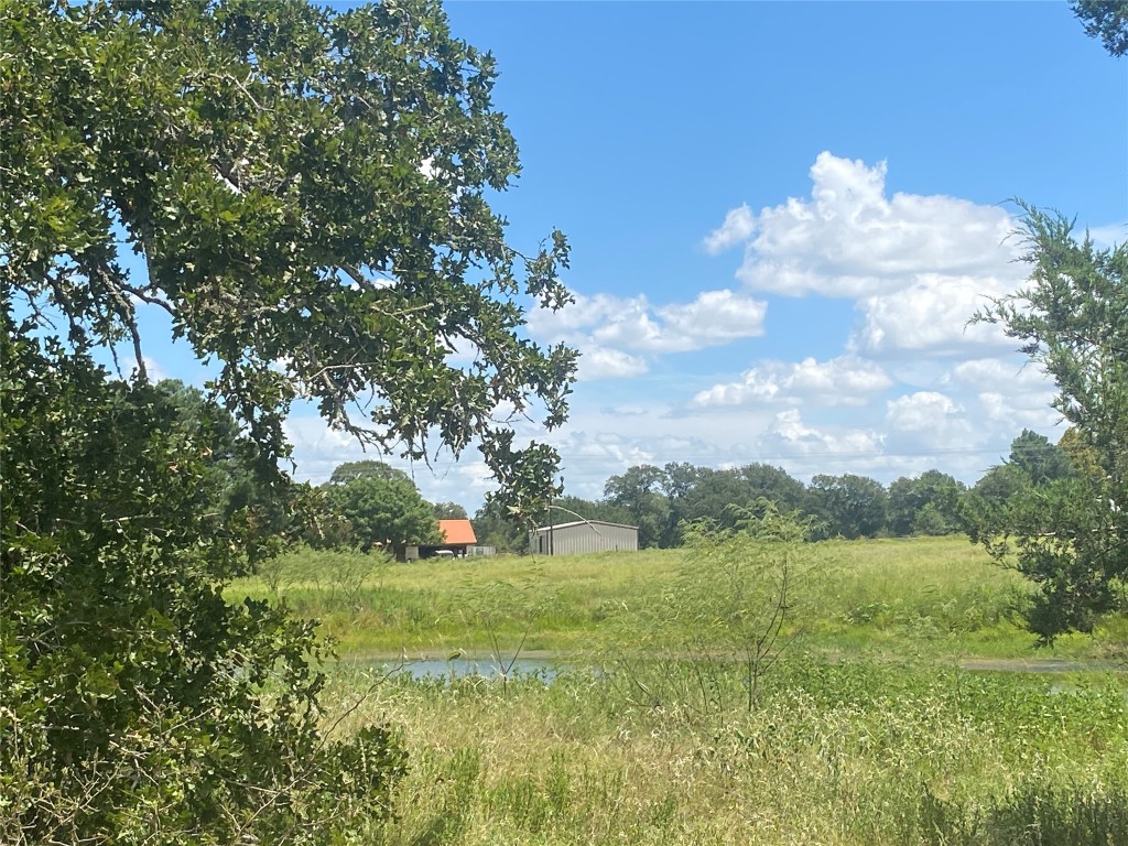 945 Justice Road West Point, TX 78963 - Photo 4 of 21 a view of lake with green space