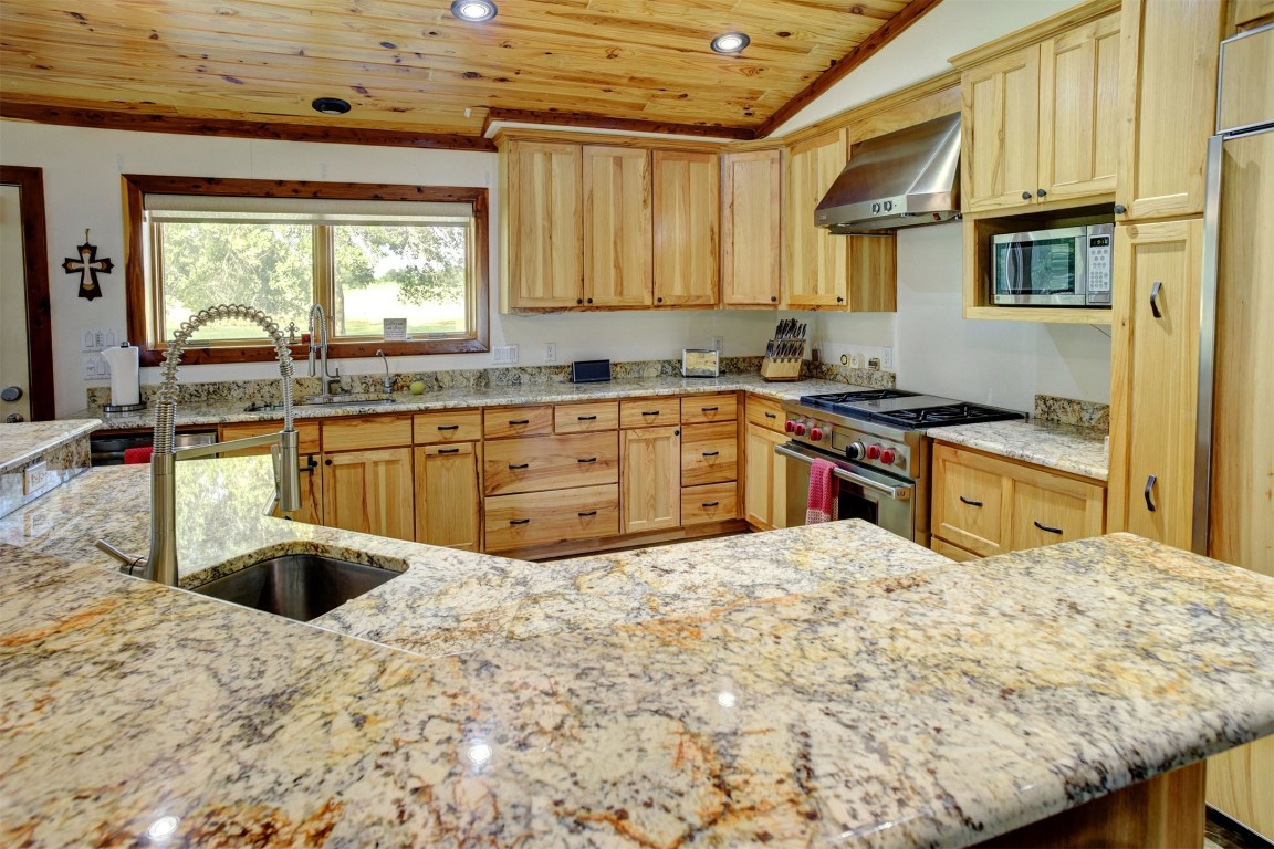 945 Justice Road West Point, TX 78963 - Photo 8 of 35 a kitchen with stainless steel appliances granite countertop a sink window and cabinets