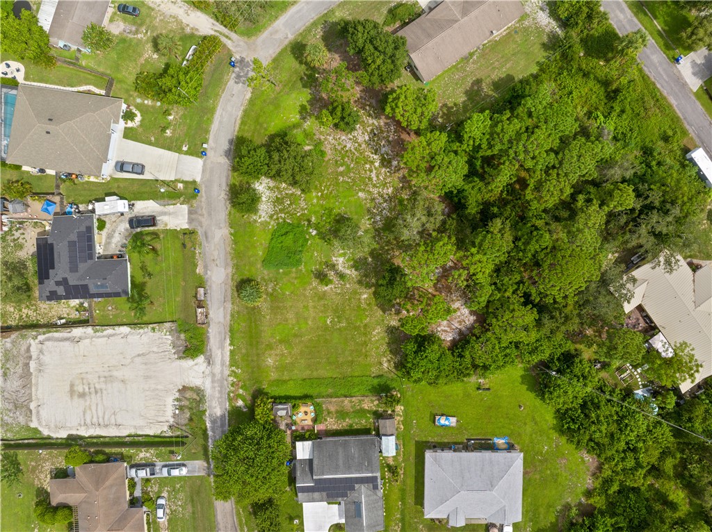 11136 Mulberry Street Sebastian, FL 32958 - Photo 3 of 11 an aerial view of a residential houses