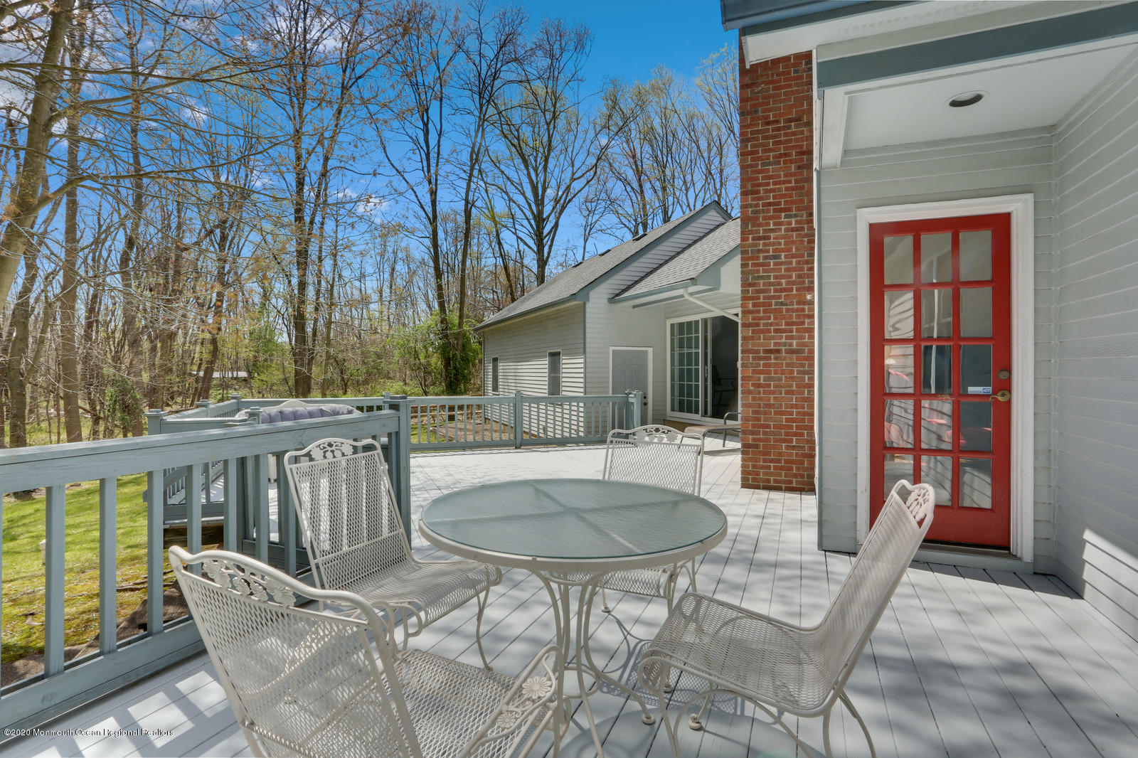 27 Rues Road Cream Ridge, NJ 08514 - Photo 44 of 46 a view of a patio with couches table and chairs and wooden floor