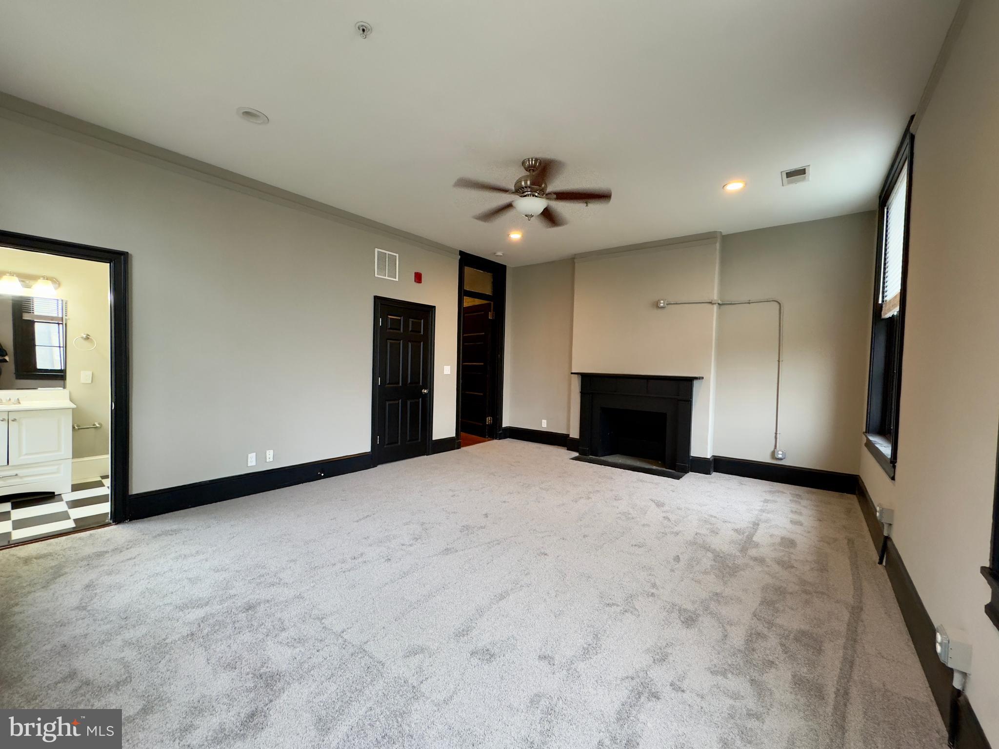 7 West Mulberry Street, Unit 8 Baltimore, MD 21201 - Photo 14 of 18 a view of empty room with a fireplace