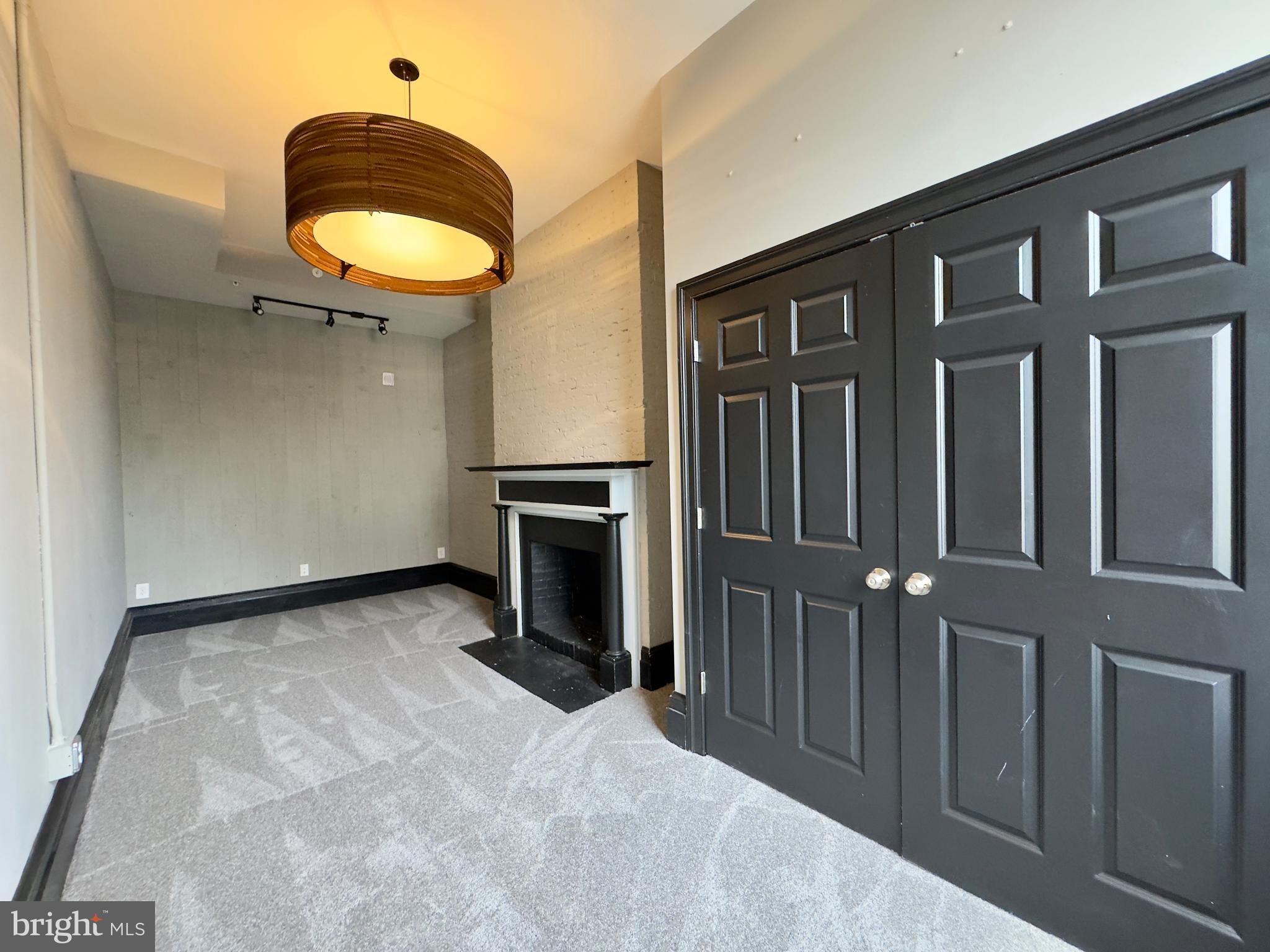 7 West Mulberry Street, Unit 8 Baltimore, MD 21201 - Photo 18 of 18 a view of a kitchen with a sink and a fireplace