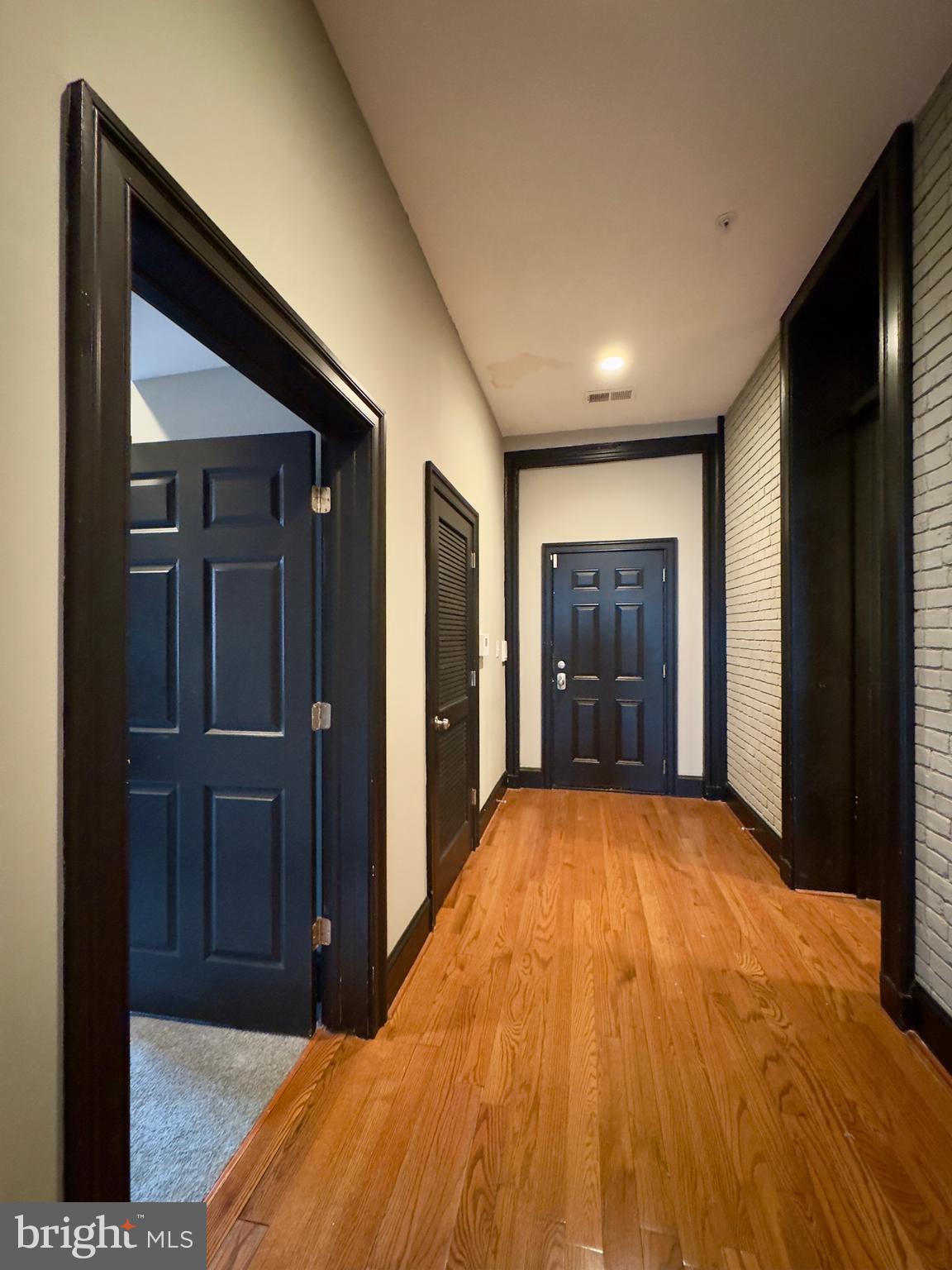 7 West Mulberry Street, Unit 8 Baltimore, MD 21201 - Photo 5 of 18 a big room with wooden floor and closet