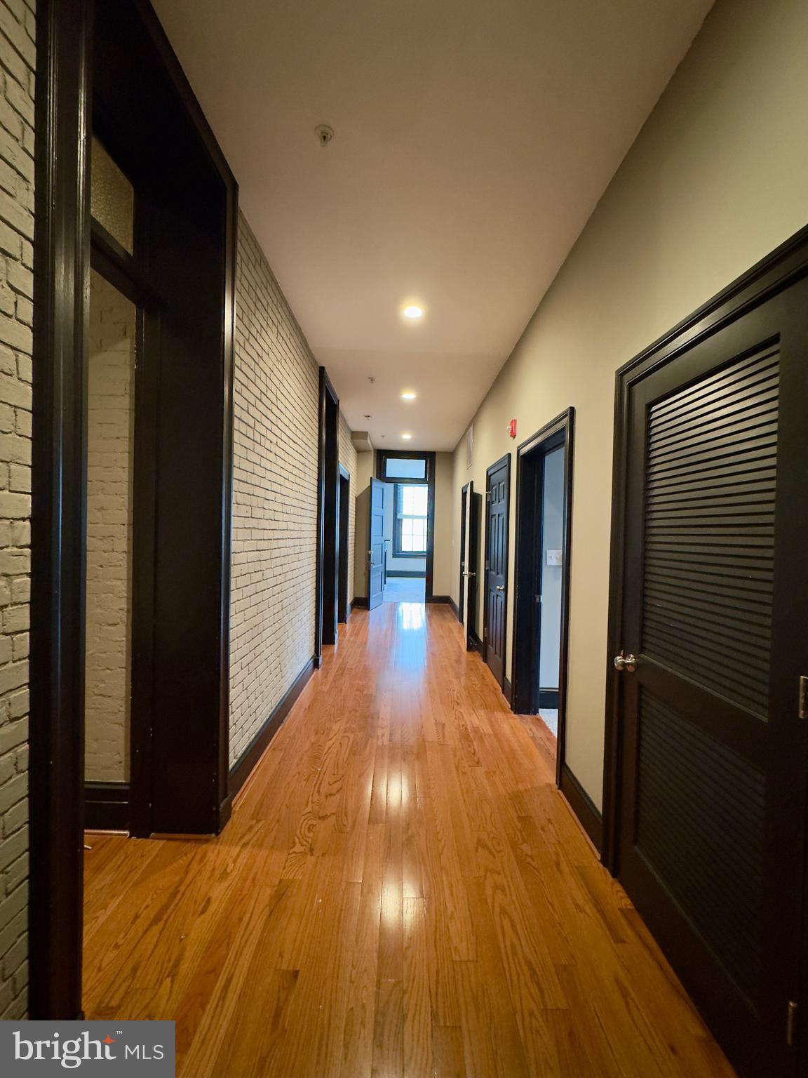7 West Mulberry Street, Unit 8 Baltimore, MD 21201 - Photo 6 of 18 a view of gallery with wooden floor