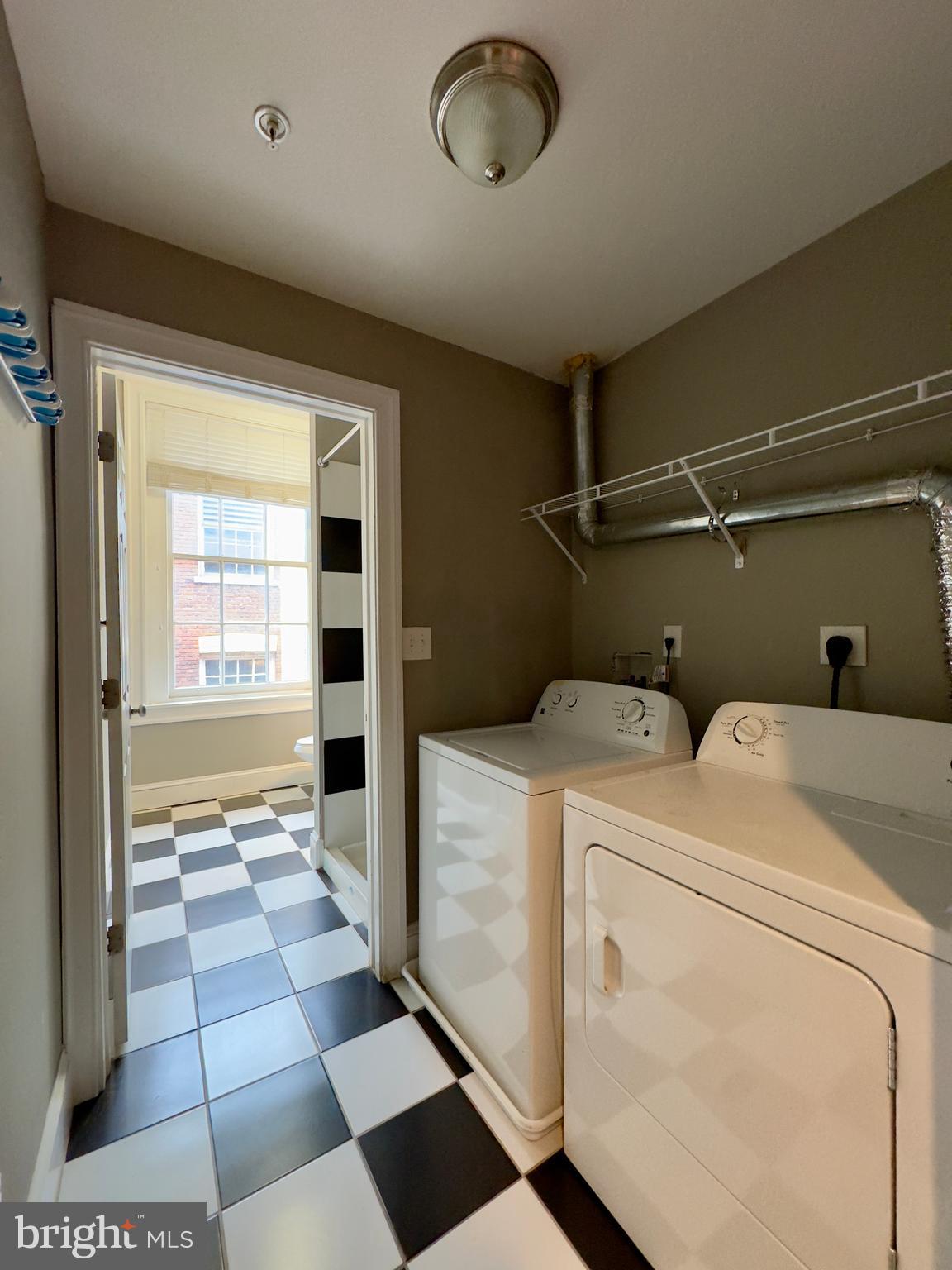 7 West Mulberry Street, Unit 8 Baltimore, MD 21201 - Photo 9 of 18 a view of storage and utility room with a washer and dryer