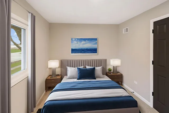 a bedroom with a bed and window