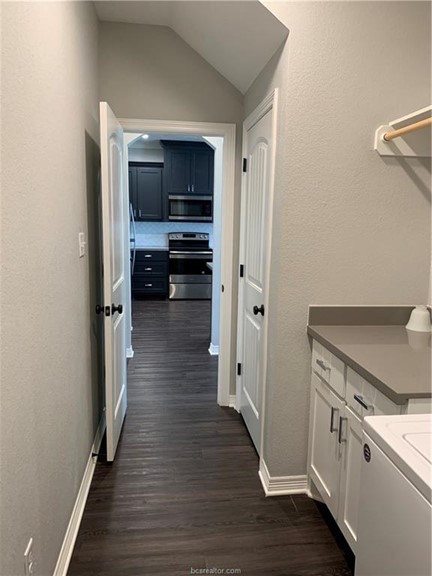 6934 Halter Loop College Station, TX 77845 - Photo 25 of 31 a view of a kitchen from the hallway