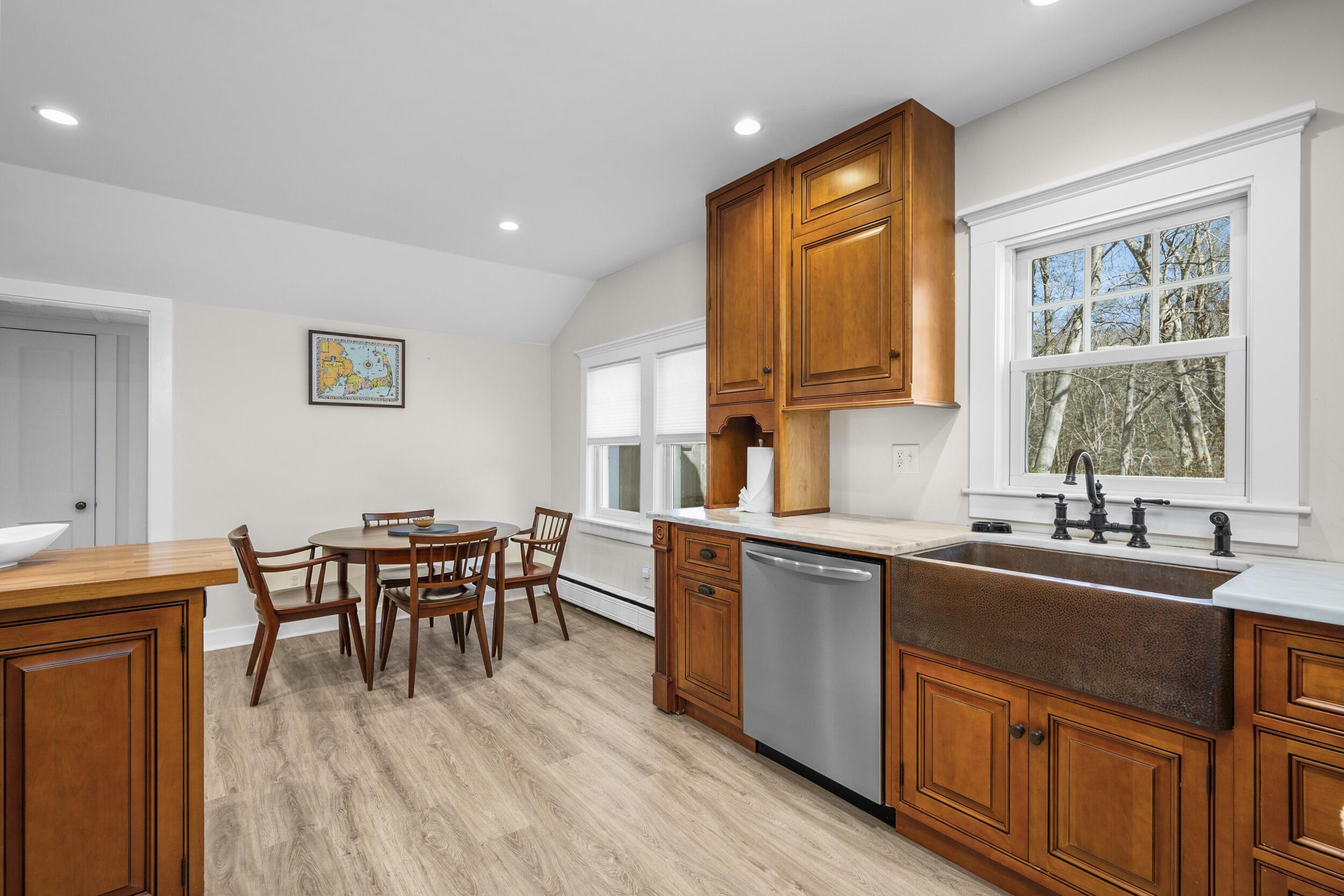 120 Main Street Cotuit, MA 02635 - Photo 13 of 40 a kitchen with stainless steel appliances granite countertop a sink dishwasher a stove a refrigerator with island and chairs