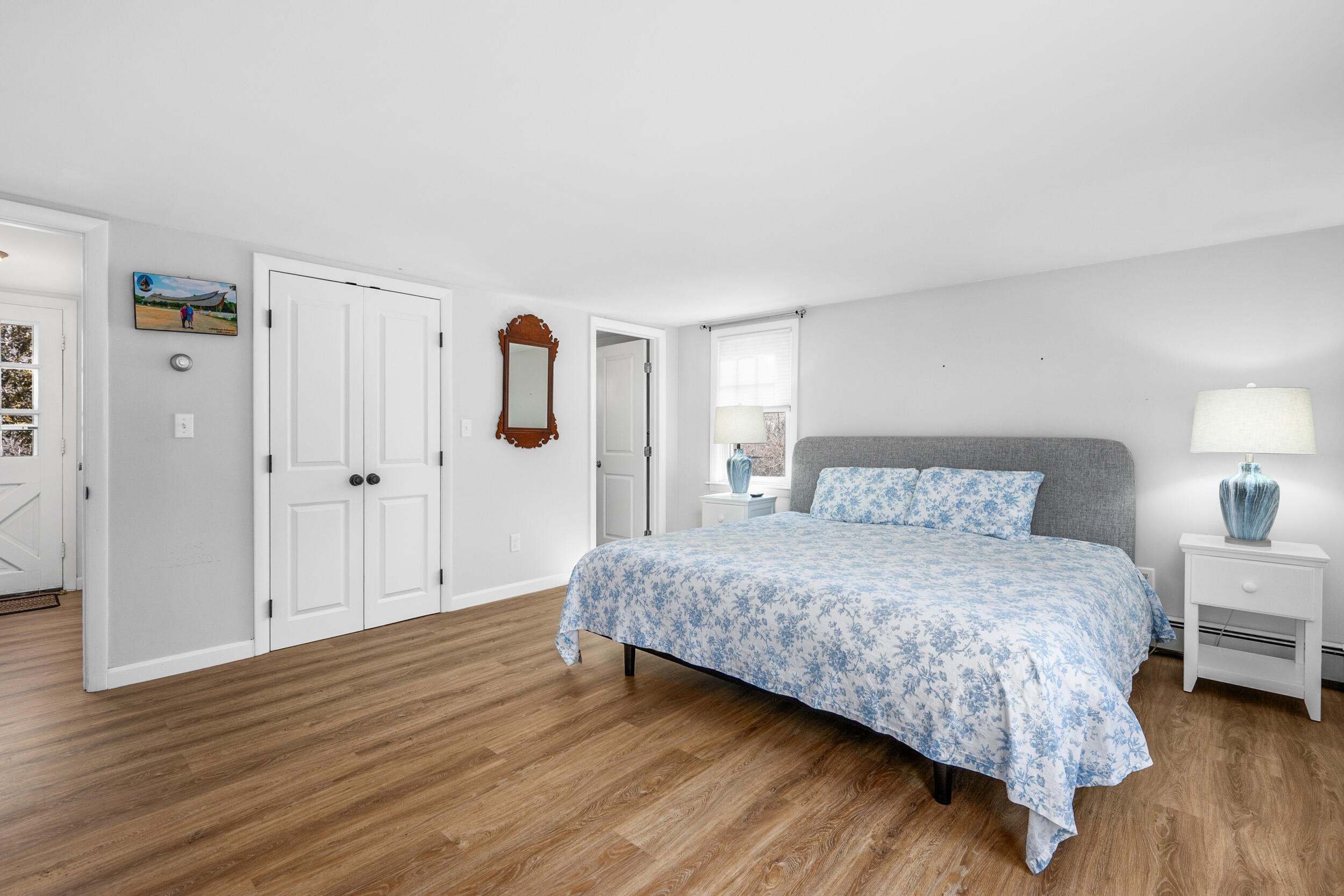 120 Main Street Cotuit, MA 02635 - Photo 15 of 40 a bedroom with a bed and wooden floor