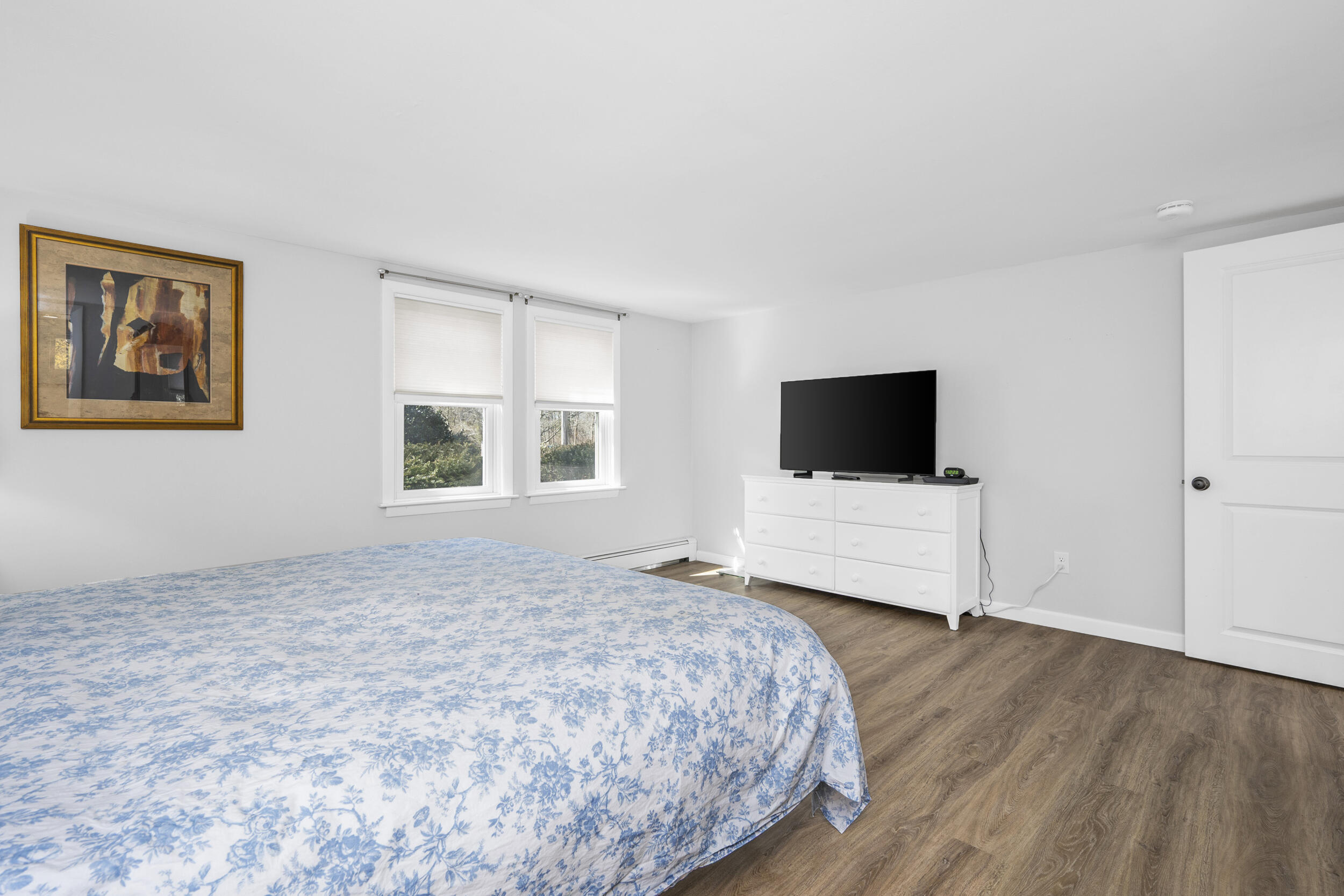 120 Main Street Cotuit, MA 02635 - Photo 16 of 40 a bedroom with a bed and a flat screen tv