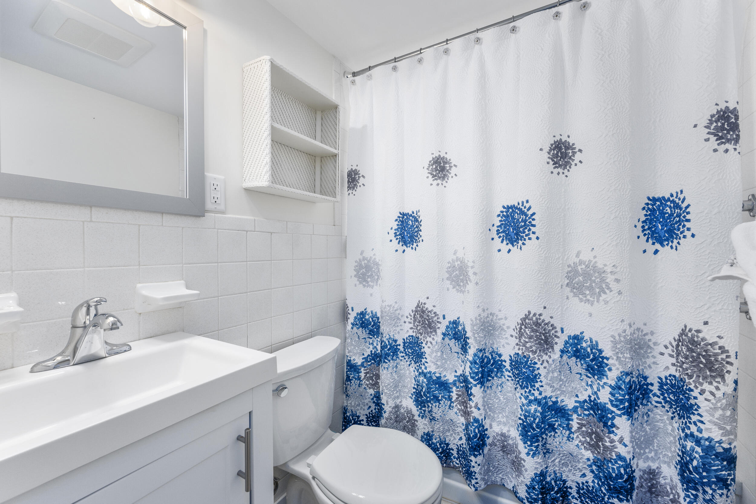 120 Main Street Cotuit, MA 02635 - Photo 23 of 40 a bathroom with a sink toilet and shower
