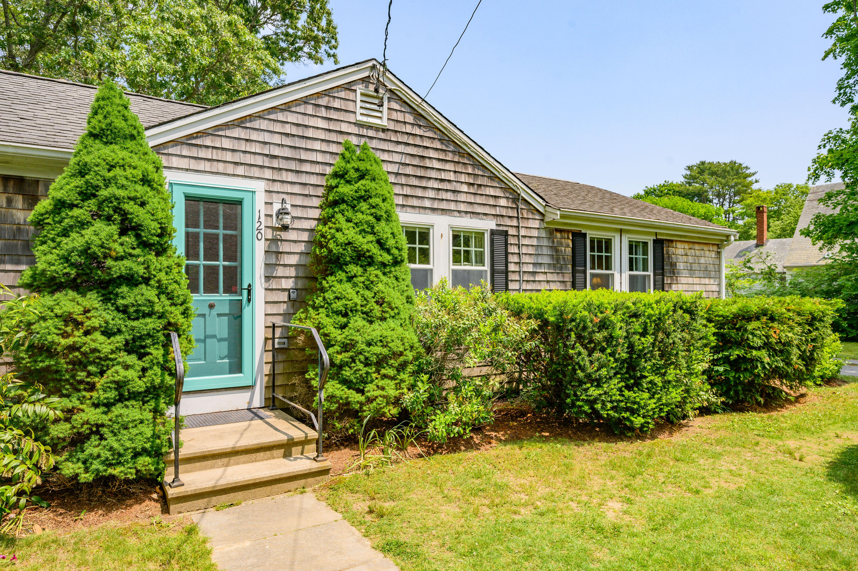 120 Main Street Cotuit, MA 02635 - Photo 3 of 40 a view of a house with potted plants
