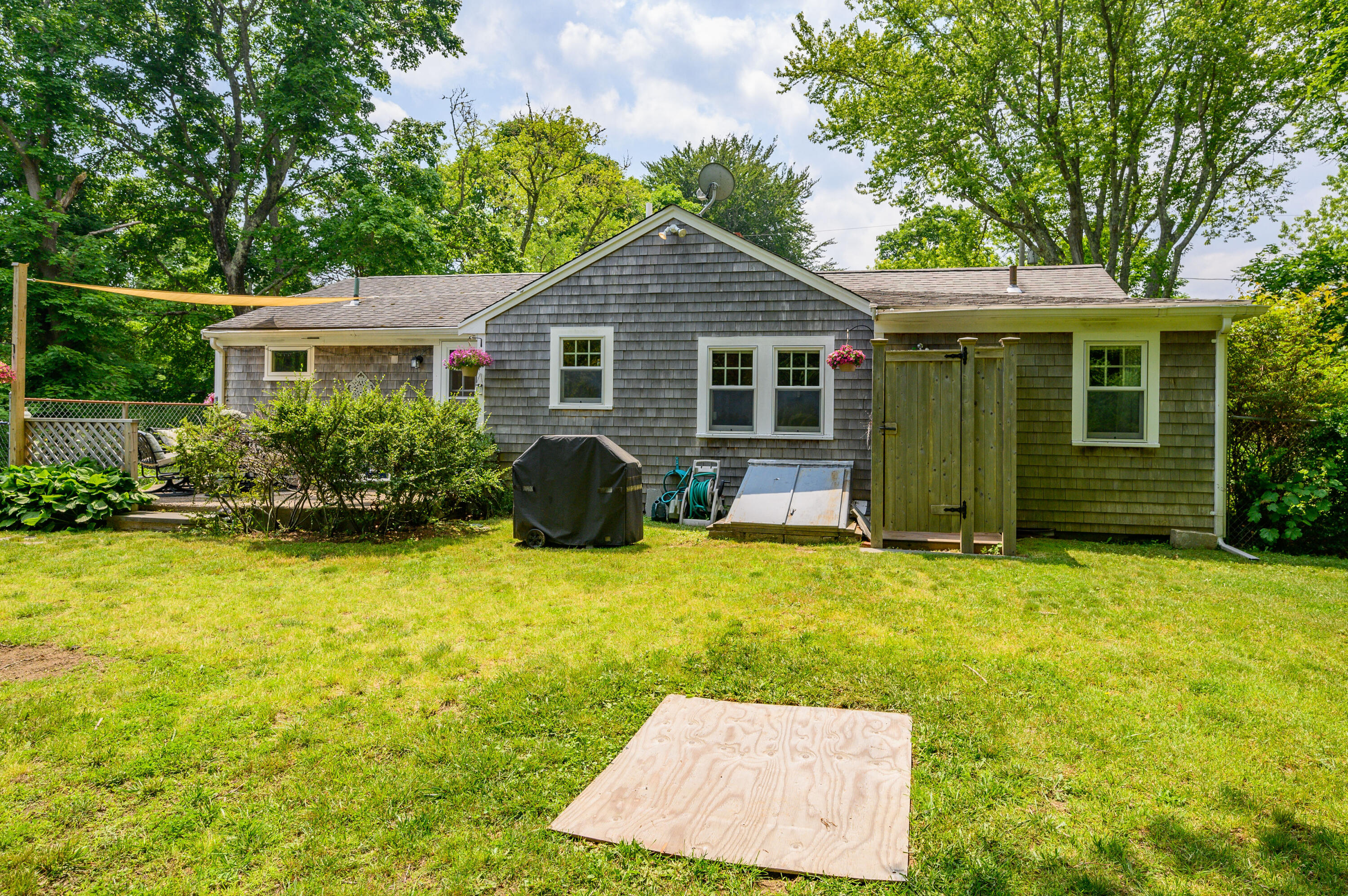 120 Main Street Cotuit, MA 02635 - Photo 32 of 40 a view of a yard in front of house