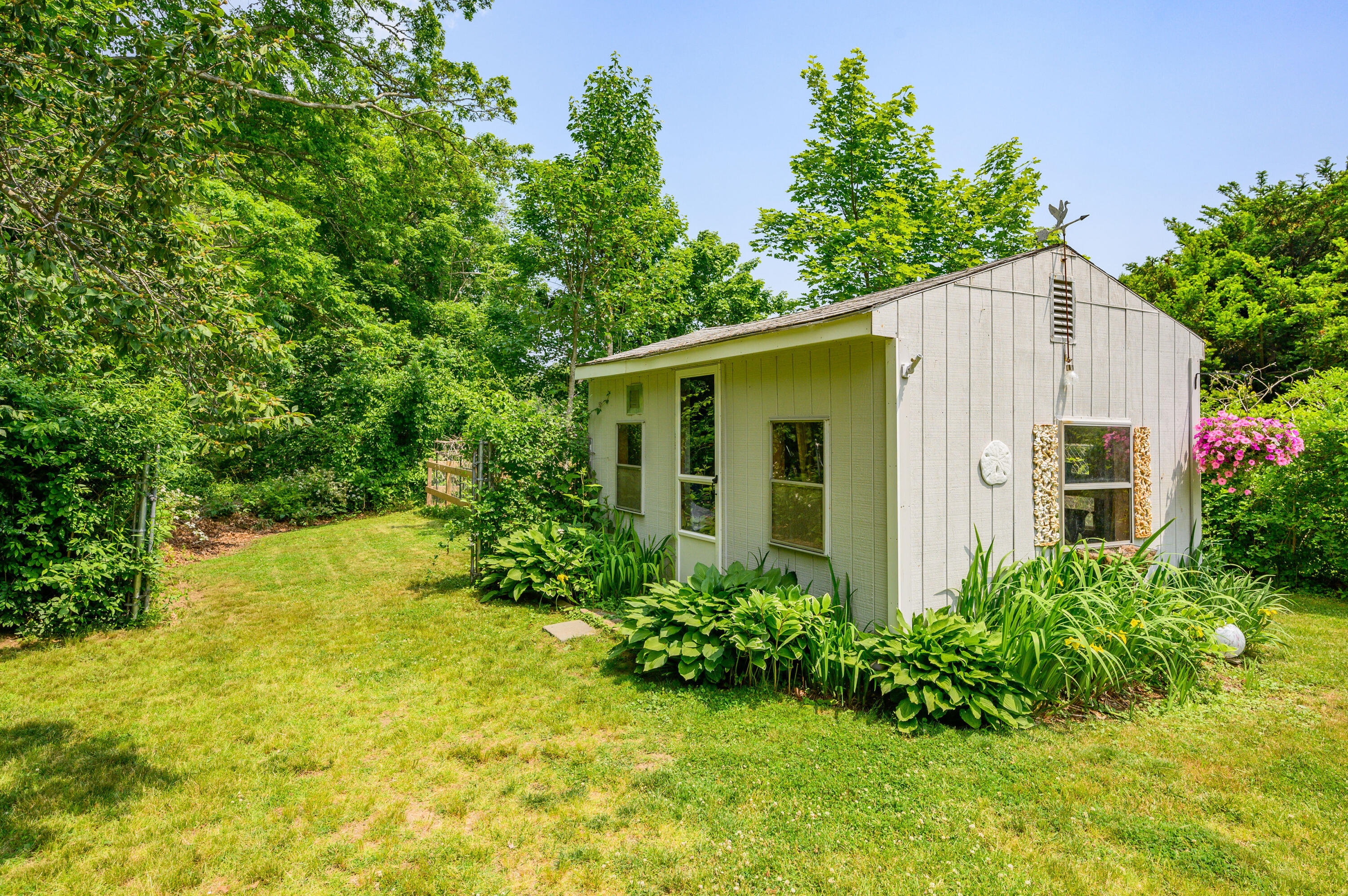 120 Main Street Cotuit, MA 02635 - Photo 36 of 40 a view of a house with pool and garden