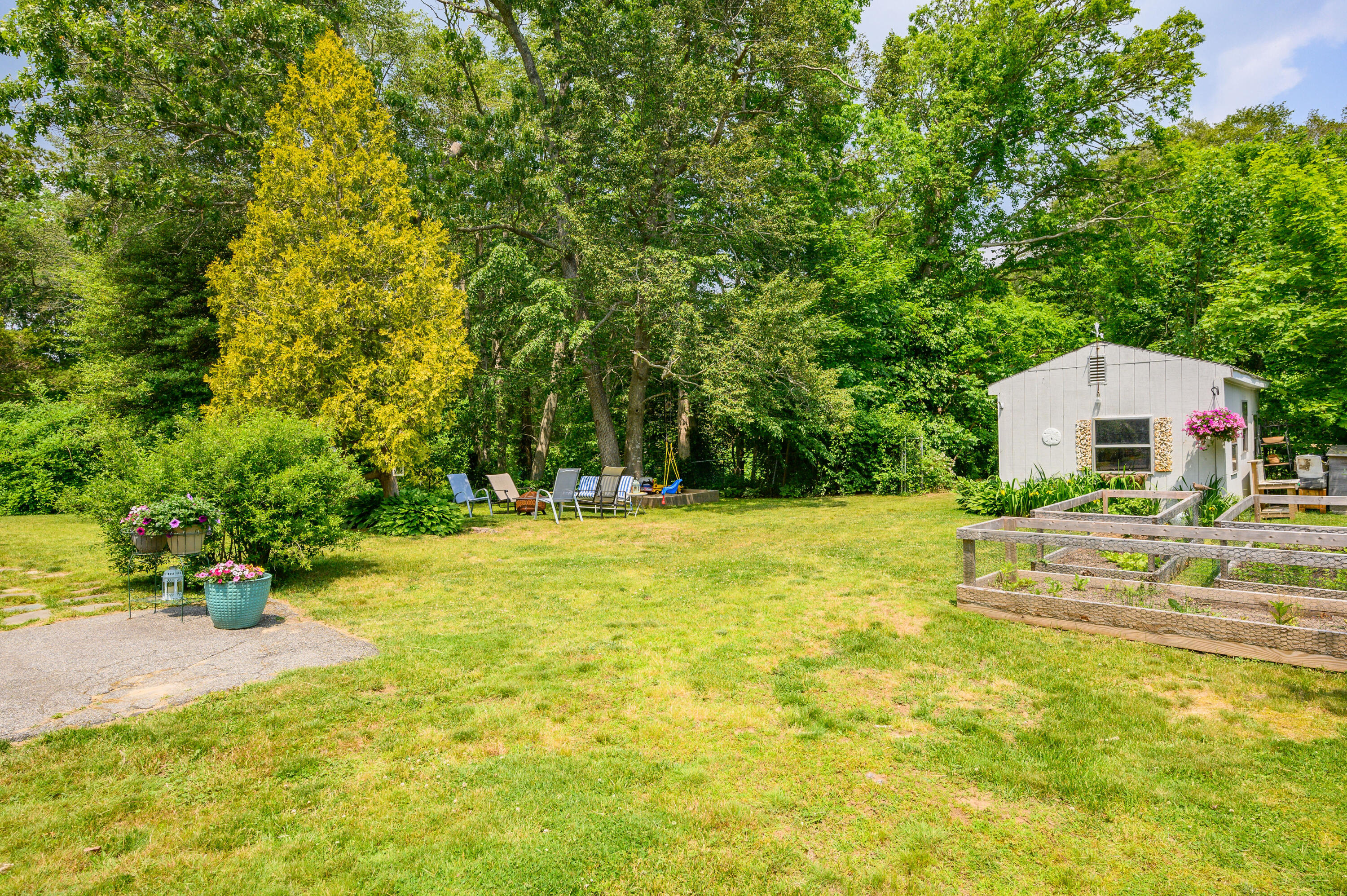 120 Main Street Cotuit, MA 02635 - Photo 37 of 40 a house view with swimming pool in front of it