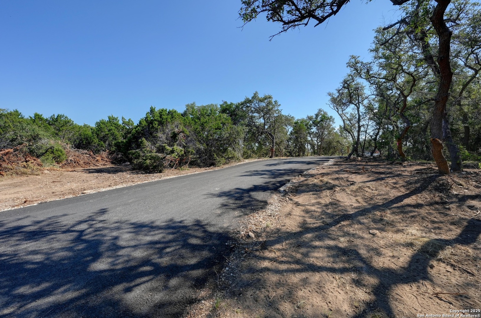 Tract 1 Pierson Road Blanco, TX 78606 - Photo 6 of 12 a view of a dirt road with a building in the background