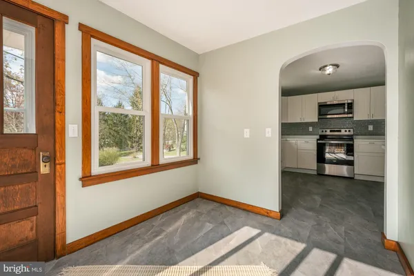 a view of kitchen with sink oven and refrigerator