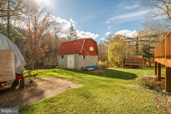 a view of a playground with basketball court