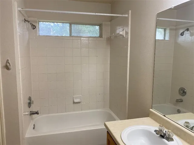 a bathroom with a sink and a tub