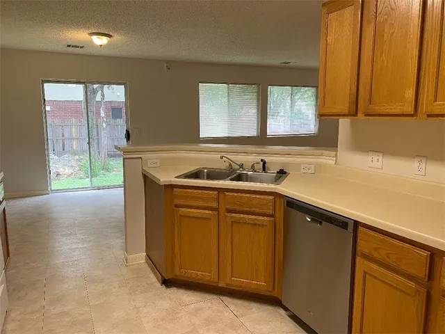 a kitchen with a sink and a window