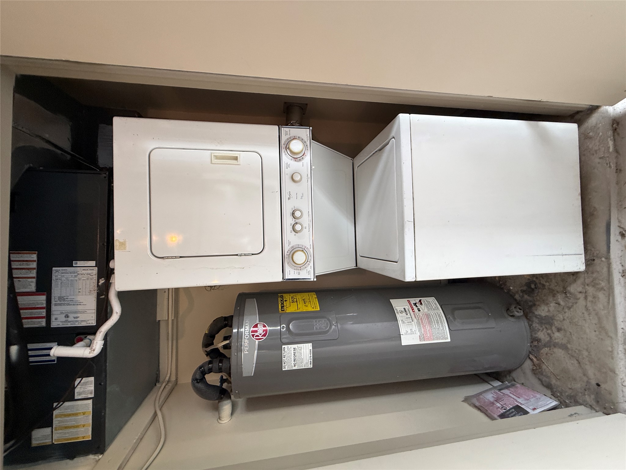 2500 Burleson Road, Unit 713 Austin, TX 78741 - Photo 12 of 15 A dedicated utility closet offers efficient laundry and water heating solutions for daily convenience.