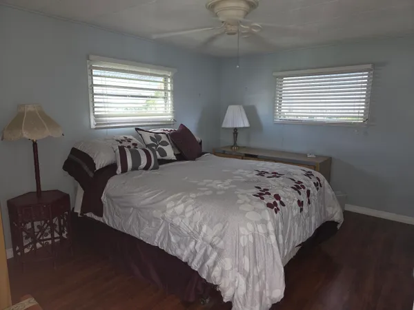 a bedroom with bed and a window
