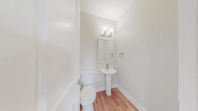 a bathroom with a double vanity sink a mirror and a shower