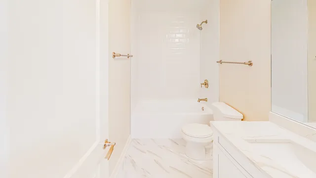 a living room with furniture a flat screen tv and a floor to ceiling window