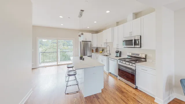 a kitchen with a table and chairs in it