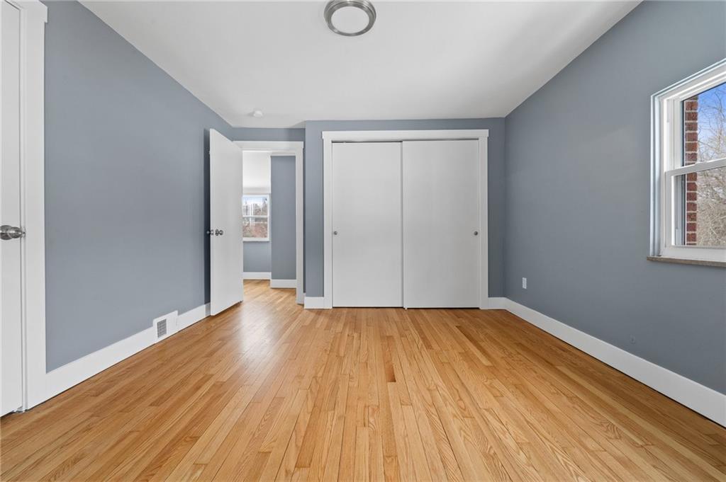 1015 McNeilly Road Pittsburgh, PA 15226 - Photo 11 of 19 a view of an empty room with wooden floor and a window