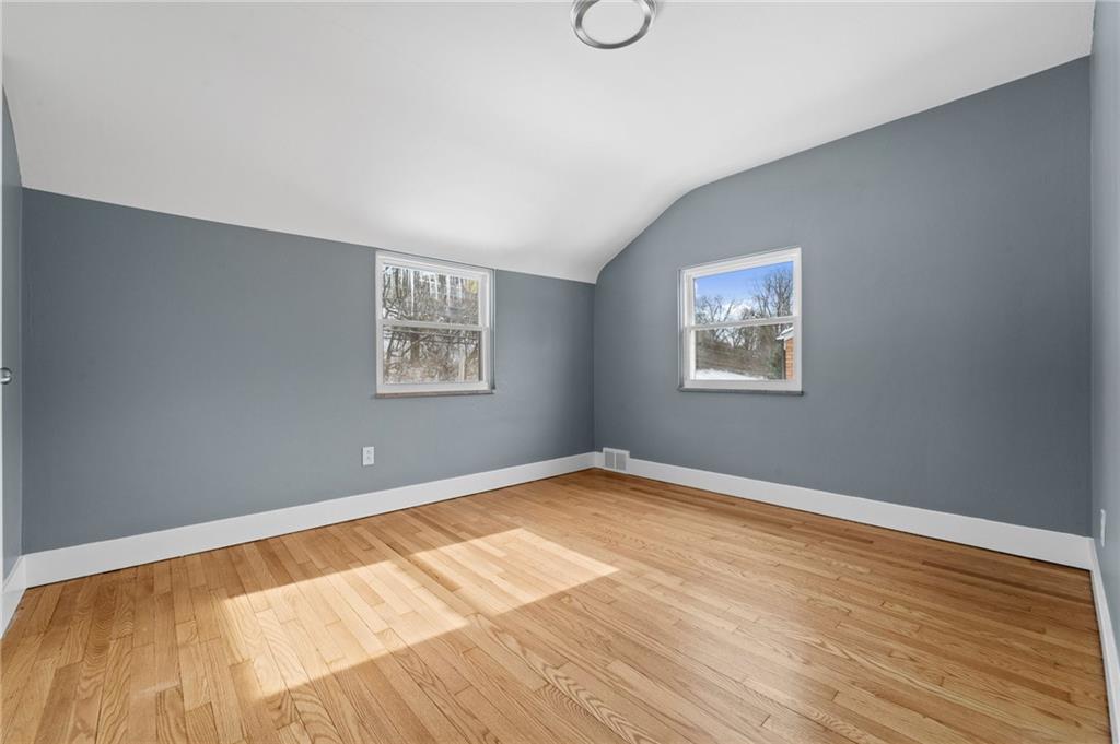 1015 McNeilly Road Pittsburgh, PA 15226 - Photo 13 of 19 a view of an empty room with wooden floor and a window