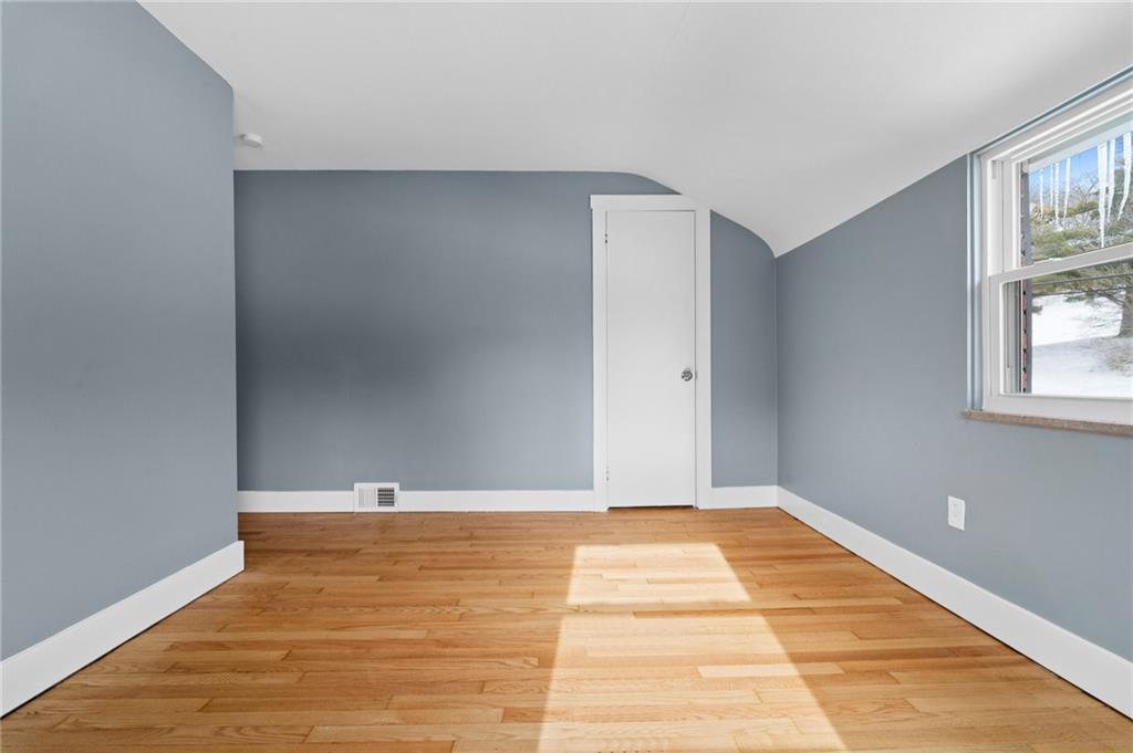 1015 McNeilly Road Pittsburgh, PA 15226 - Photo 14 of 19 a view of an empty room with window and wooden floor