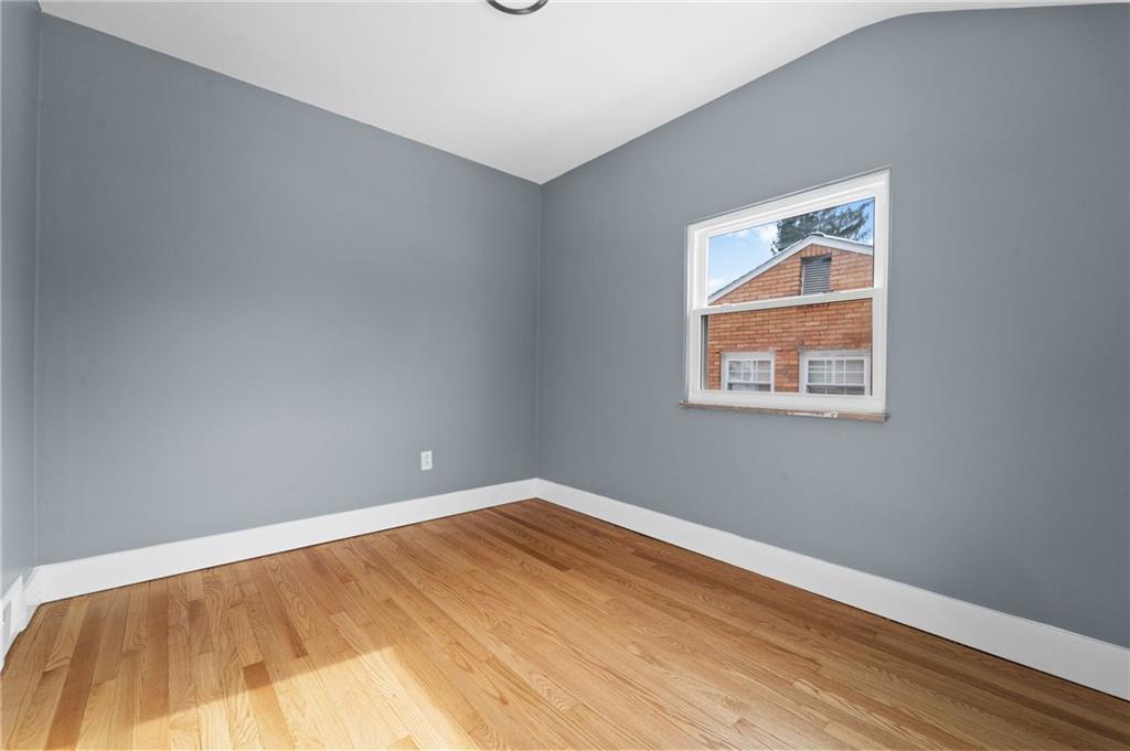 1015 McNeilly Road Pittsburgh, PA 15226 - Photo 16 of 19 a view of empty room with wooden floor