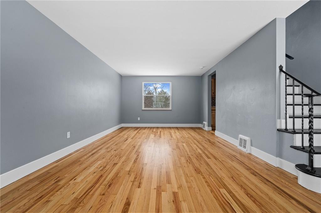 1015 McNeilly Road Pittsburgh, PA 15226 - Photo 4 of 19 wooden floor in an empty room with a window