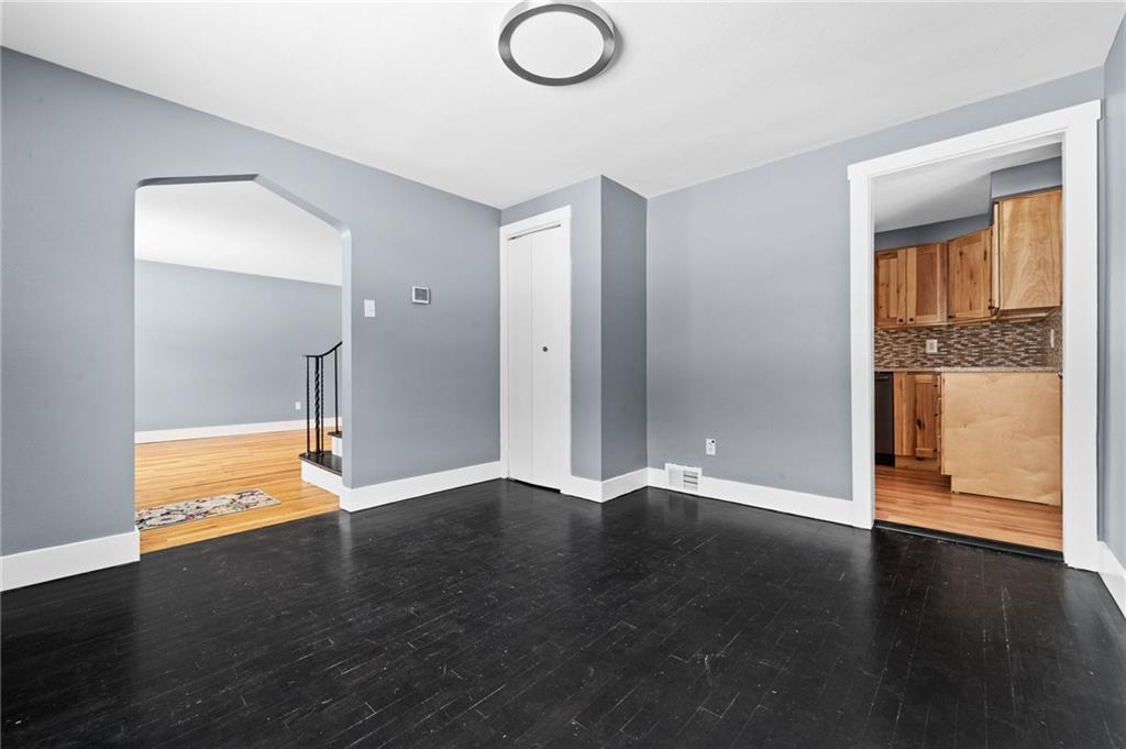 1015 McNeilly Road Pittsburgh, PA 15226 - Photo 6 of 19 an empty room with wooden floor and a window