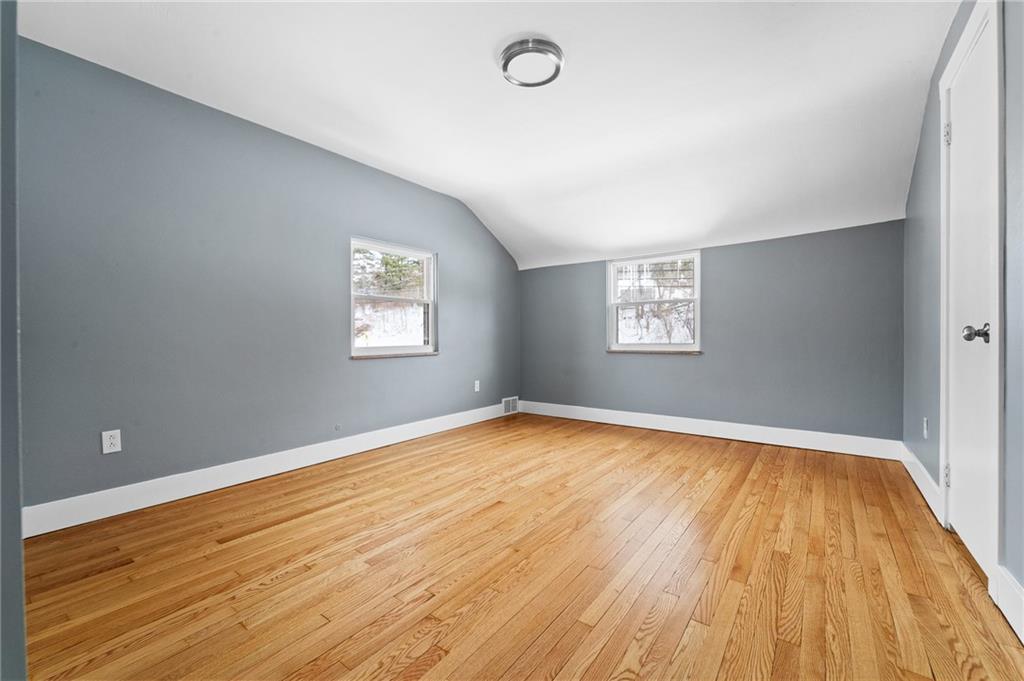 1015 McNeilly Road Pittsburgh, PA 15226 - Photo 10 of 19 an empty room with wooden floor and windows