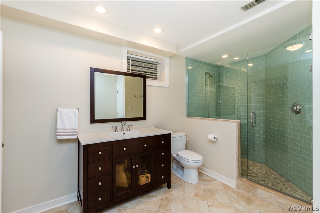 3521 Buckhead Road Midlothian, VA 23113 - Photo 40 of 48 a bathroom with a double vanity sink toilet mirror and shower