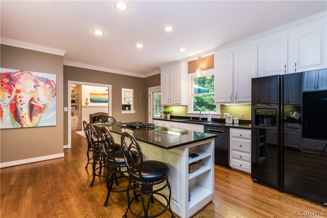 3521 Buckhead Road Midlothian, VA 23113 - Photo 7 of 48 a kitchen with granite countertop kitchen island wooden cabinets and stainless steel appliances