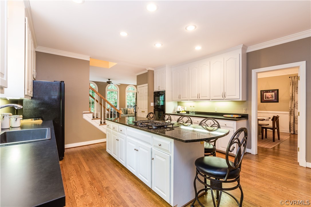 3521 Buckhead Road Midlothian, VA 23113 - Photo 8 of 48 a kitchen with stainless steel appliances granite countertop a sink and a refrigerator