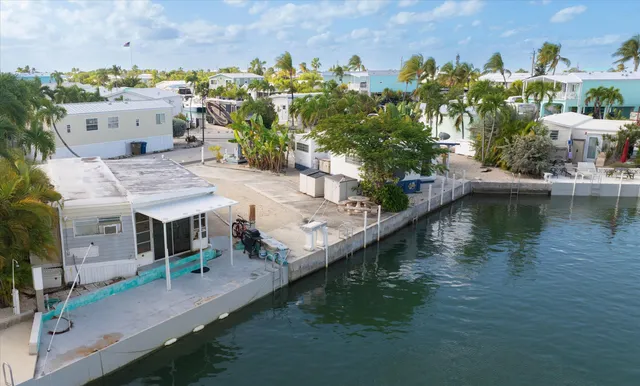 aerial view of a house with a lake view