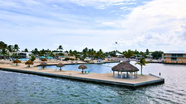a view of a swimming pool with outdoor seating