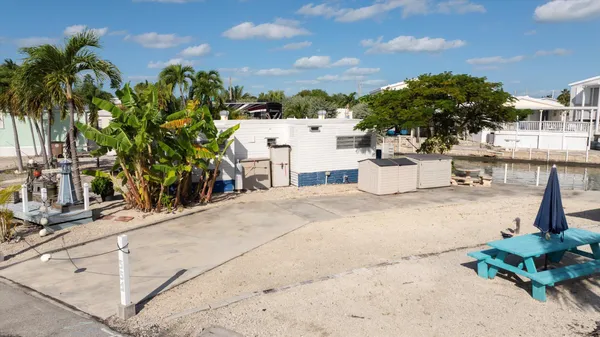 a view of a terrace with a garden and potted plants