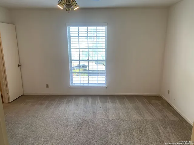 an empty room with a bathroom