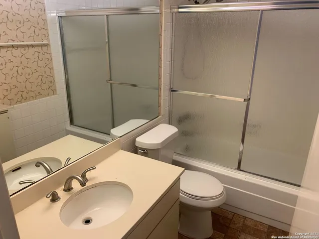 a view of a pathway that has small yard