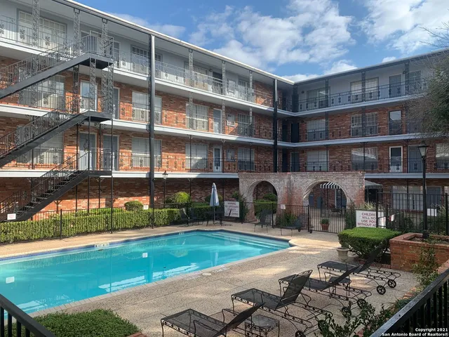 a view of a building with a yard