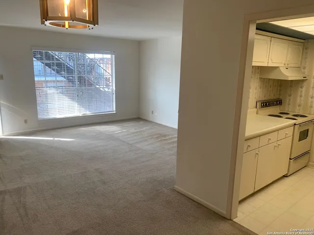a kitchen with a sink a stove and refrigerator
